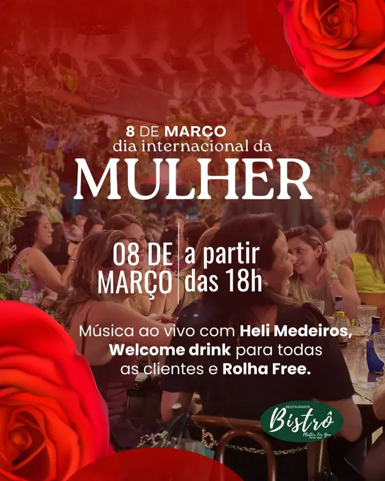 Imagem do interior do Restaurante Bistrô decorado com rosas vermelhas, com clientes desfrutando de um ambiente festivo. O evento será no Dia Internacional da Mulher, 8 de março, a partir das 18h, com música ao vivo de Heli Medeiros, welcome drink e rolha free.